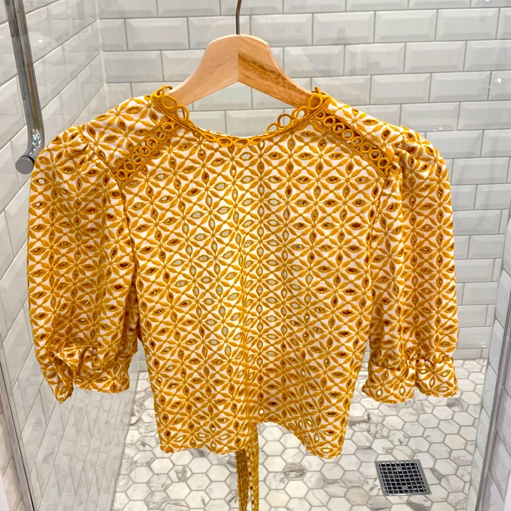 Top Show NWT sheer/open back top